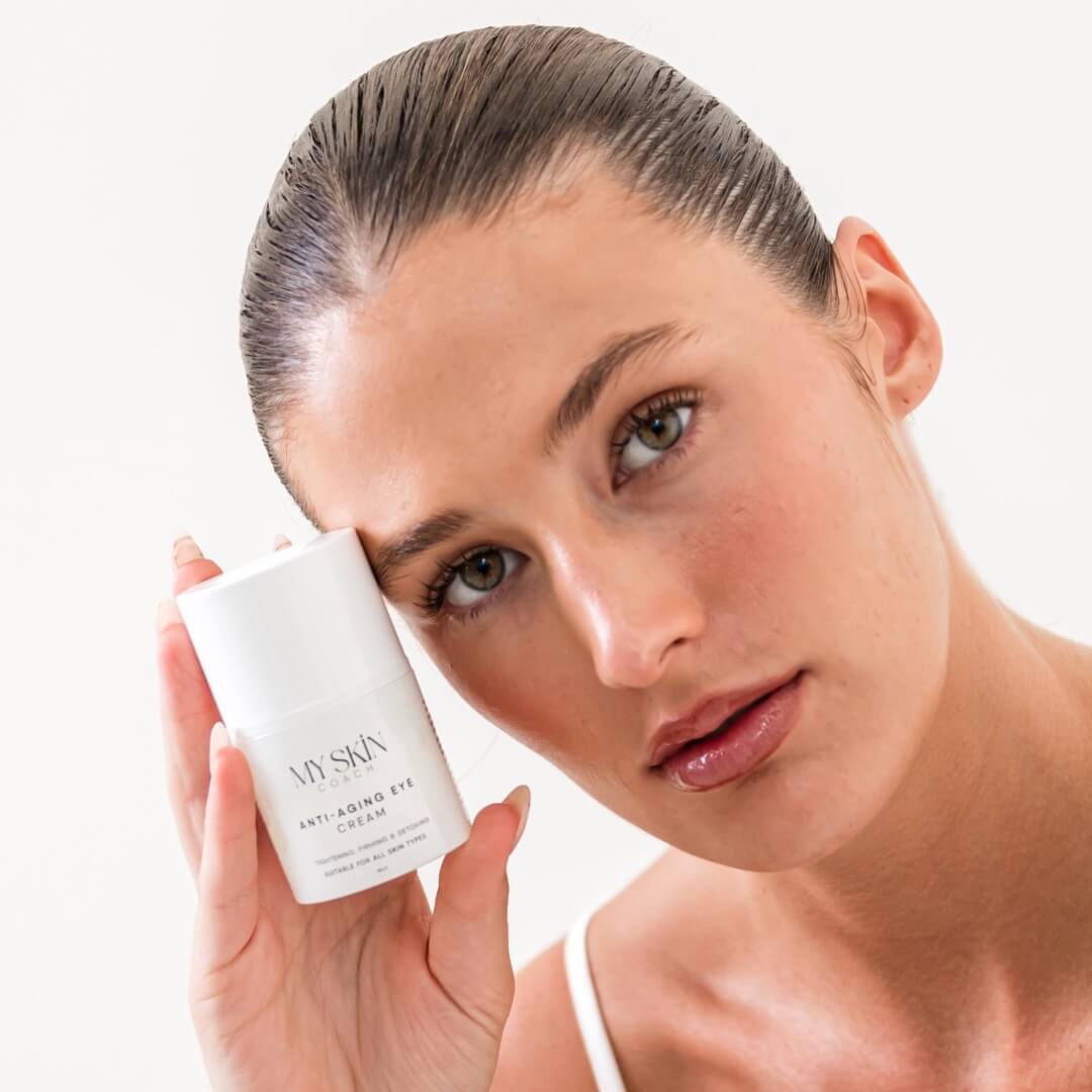 woman holding anti-aging eye cream