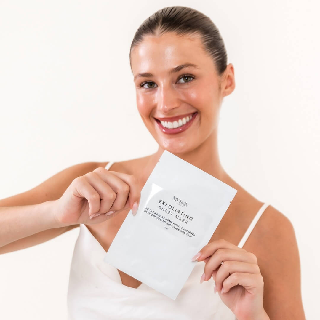 woman holding exfoliating mask pack