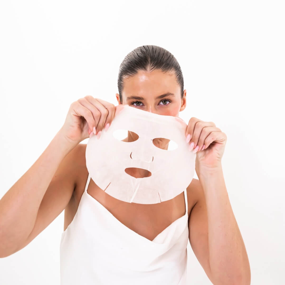 woman holding exfoliating mask