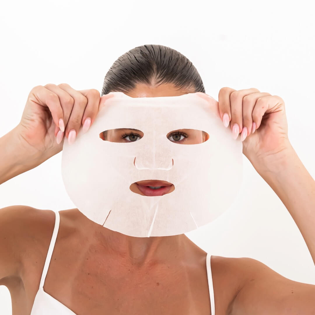 woman holding anti aging mask